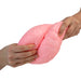 Pink brain-shaped stress ball being held by two hands on a white background
