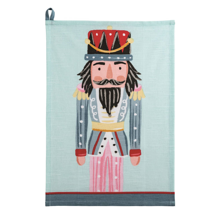 Towel with a nutcracker design on a light blue background