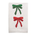 White towel with red and green embroidered bows on a white background