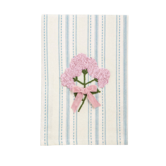Striped towel with pink floral design and bow on a white background