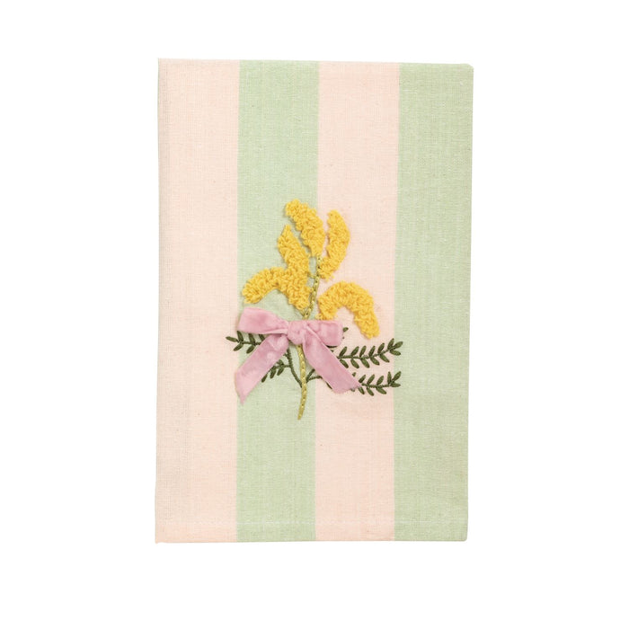 Striped towel with floral embroidery on a white background