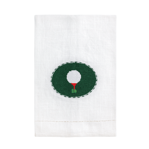 White towel with a green circle featuring a white golf ball and red and white flag on a white background