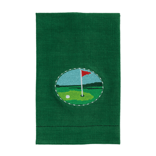 Green towel with a golf course design featuring a red flag and white ball on a white background