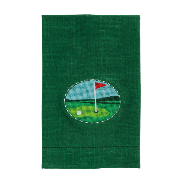 Green towel with a golf course design featuring a red flag and white ball on a white background