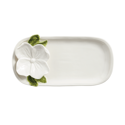 Rectangular ceramic tray with a white floral design on a white background