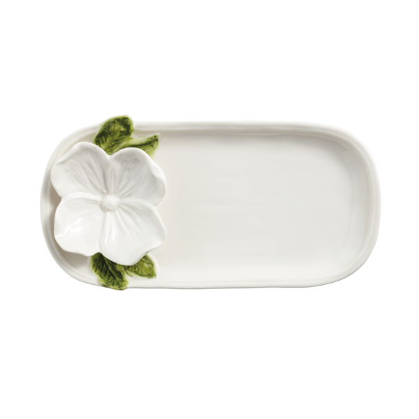Rectangular ceramic tray with a white floral design on a white background