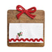 Wooden cutting board with a red bow and embroidered white towel on a white background