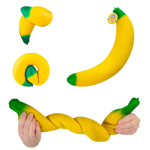 Banana-shaped dog toy with green ends on a white background