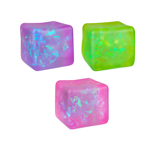 Three translucent cube-shaped decorative pieces in purple, green, and pink, each with iridescent crystalline inclusions, arranged on a plain white background.