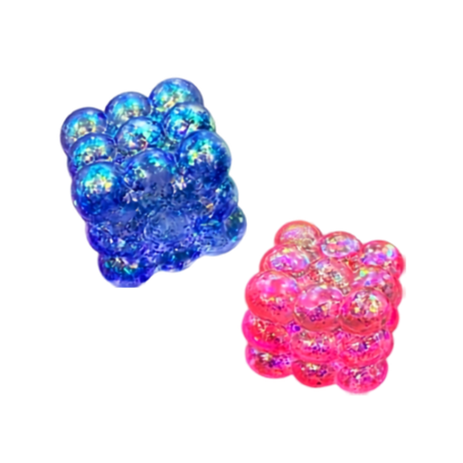 Two cube-shaped clusters of glossy, iridescent glitter beads, one in blue and one in pink, shown on a plain white background.