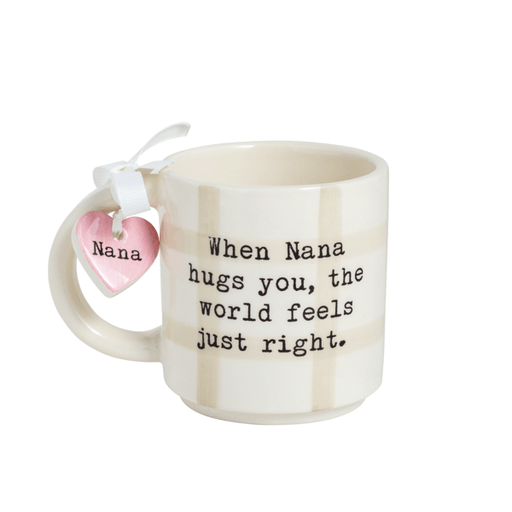 Mug with text 'When Nana hugs you, the world feels just right.' and a heart-shaped tag on a white background