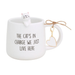 White mug with a cat design and text 'The cat's in charge we just live here' on a white background