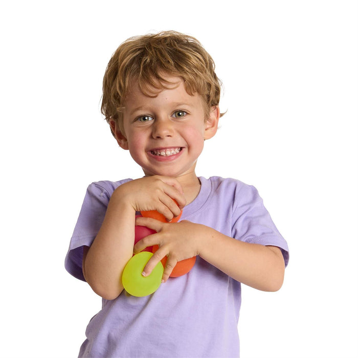 Child holding a colorful toy with a white background