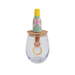 Decorative wine glass with a cork stopper and small bottle on top, featuring a pink gemstone ring design.
