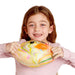Young girl holding a colorful fish-shaped object against a white background