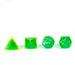 Set of green polyhedral dice on a white background
