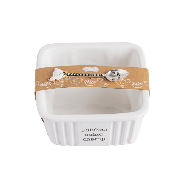 White ceramic dish with 'Chicken salad champ' text and a decorative band on a white background