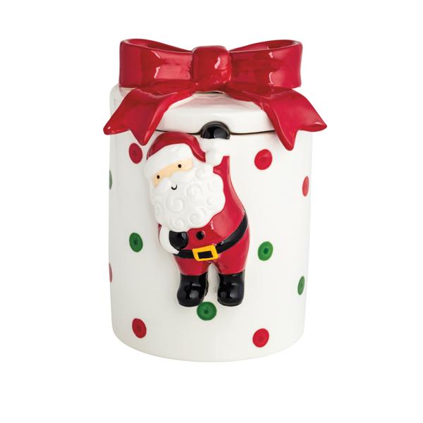 Decorative cookie jar with Santa Claus design and red bow on a white background