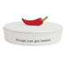 White trinket dish with a red chili pepper on top and 'Things just got heated' text.
