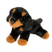 Plush toy dog with black and brown fur on a white background