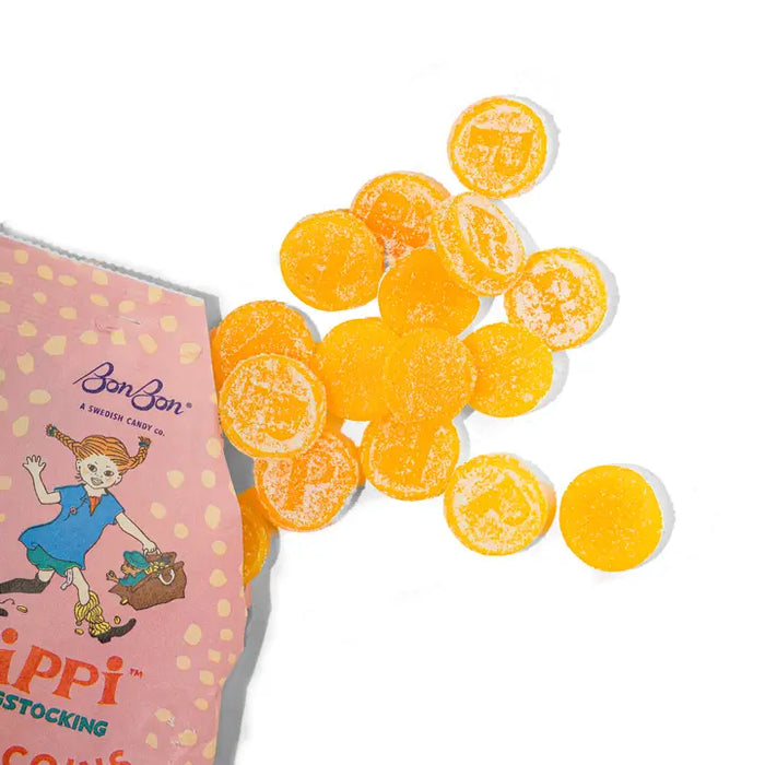 Orange candy pieces with a pink box featuring a character on a white background