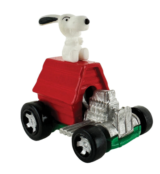 Toy car with a dog figure on top against a white background