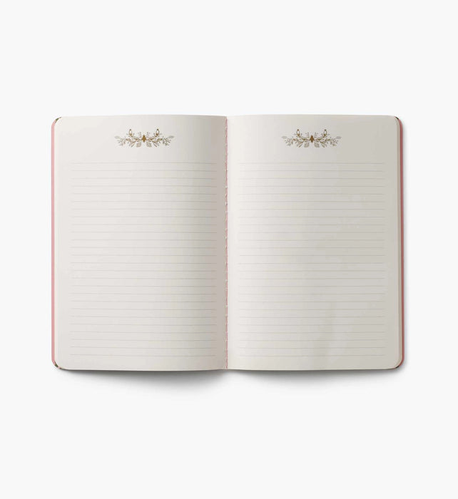 Open notebook with lined pages on a white background