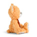 Plush dog toy with a tag on a white background