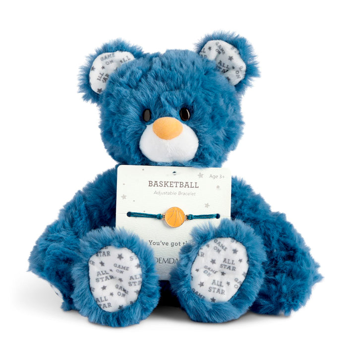 Blue teddy bear holding a basketball-themed card on a white background