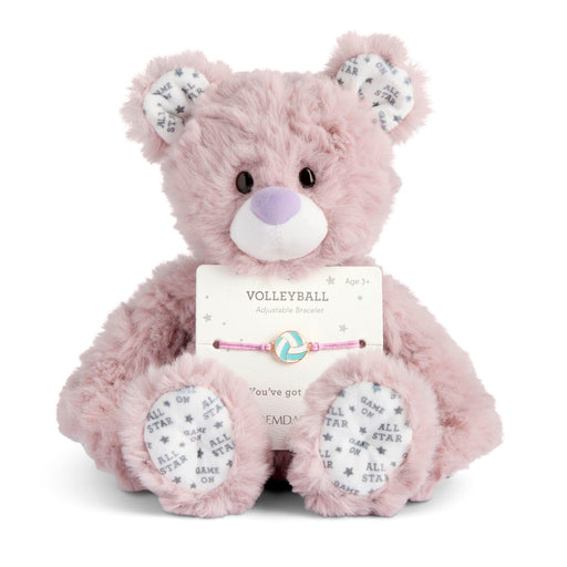 Pink teddy bear with a bracelet on a white background