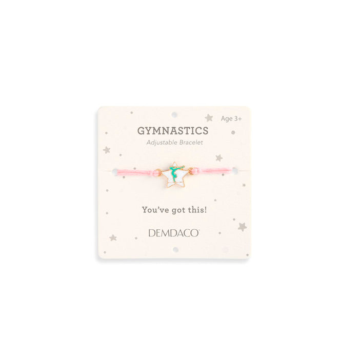 Gymnastics adjustable bracelet on a Demdaco branded card with decorative elements.