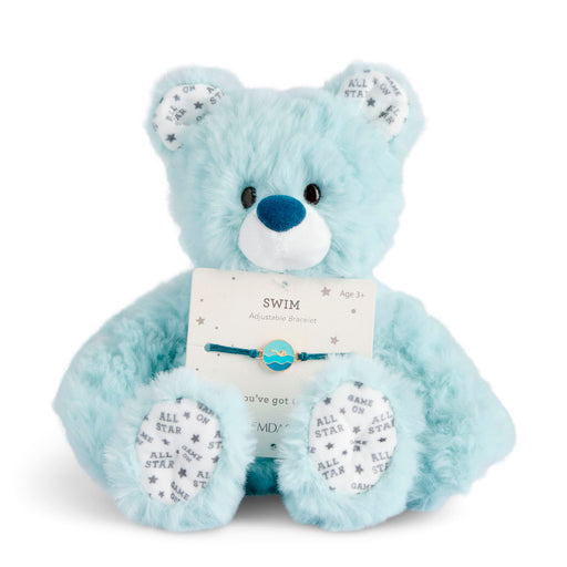 Light blue teddy bear with a tag on a white background