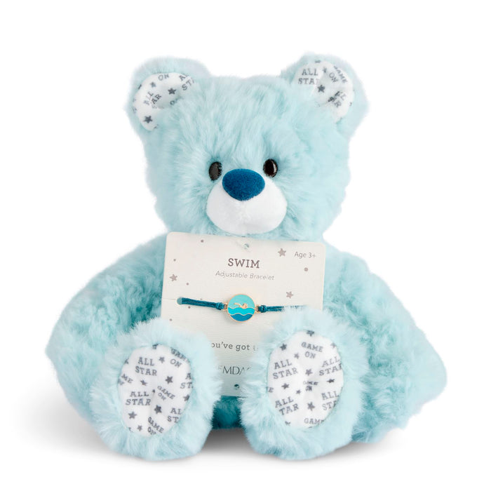 Light blue teddy bear with a tag on a white background
