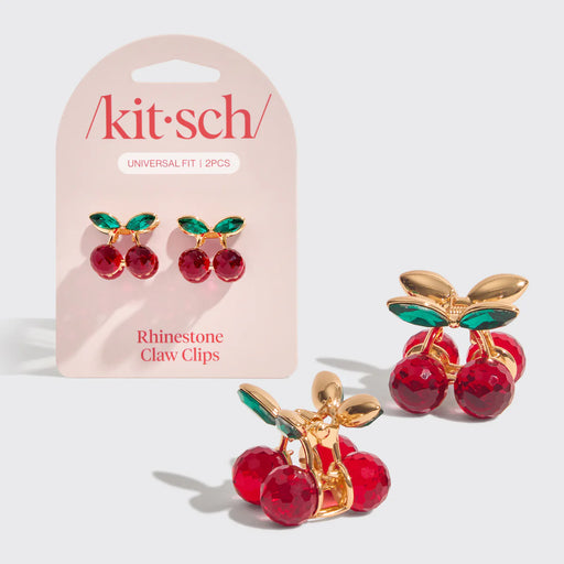 Cherry-themed rhinestone claw clips with 'kitsch' packaging on a light gray background