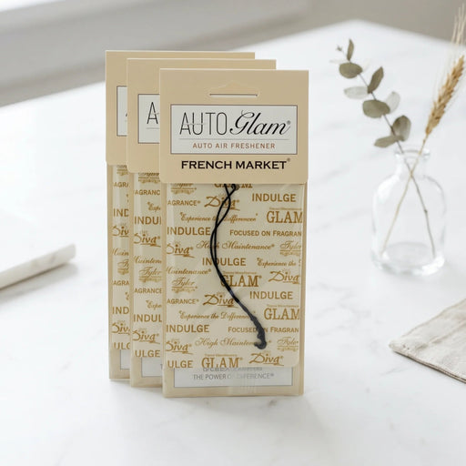 Auto air freshener packaging with 'Auto Glam' branding on a white surface.