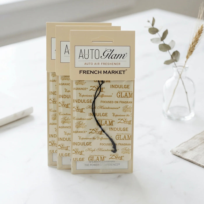 Auto air freshener packaging with 'Auto Glam' branding on a white surface.