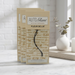Auto Glam auto air freshener packaging on a marble surface with a blurred background