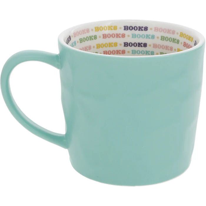 Light blue mug with 'BOOKS' text pattern on a white background