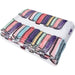 Folded blanket with colorful striped pattern on a white background