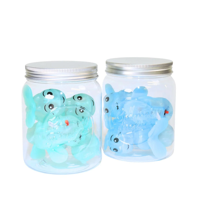 Two glass jars with metal lids containing blue firefly-like creatures on a white background