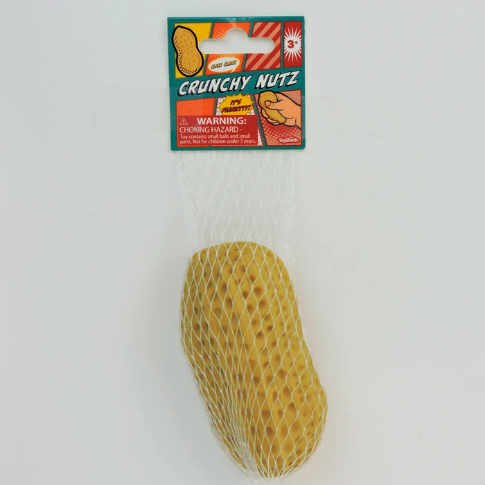 A novelty hard candy shaped like a peanut, packaged in a white mesh bag with a colorful 'Crunchy Nutz' header card, shown against a plain white background.