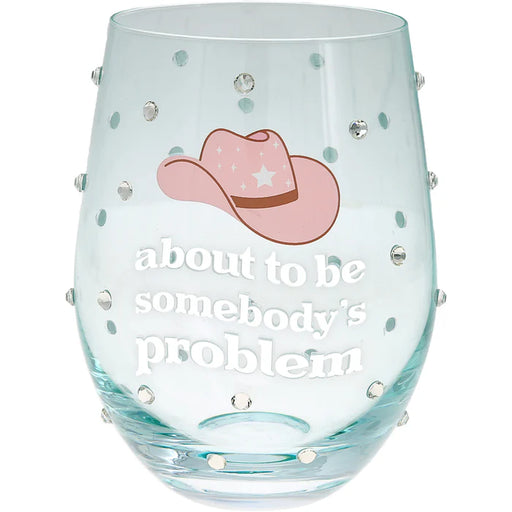 Clear glass with pink cowboy hat and text 'about to be somebody's problem' on a white background