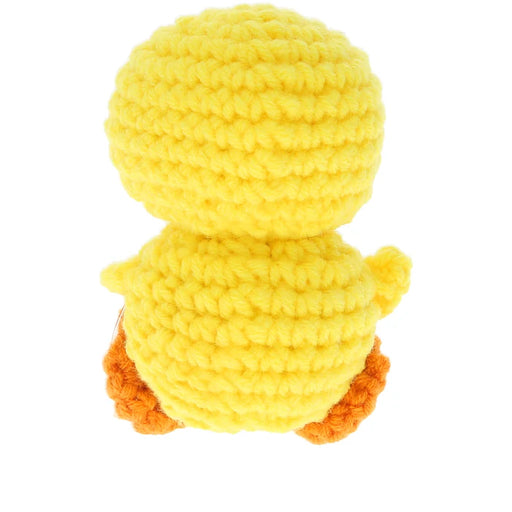 A yellow crocheted plush toy shaped like a duckling, shown from the back against a plain white background.