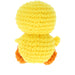 A yellow crocheted plush toy shaped like a duckling, shown from the back against a plain white background.