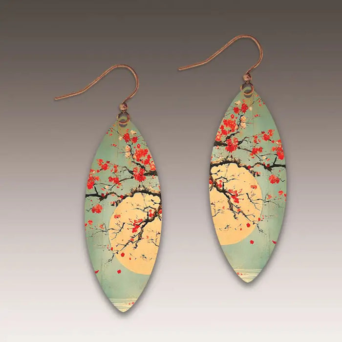 Pair of earrings with cherry blossom design on a gradient background