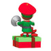 Christmas elf figurine with red hat and green outfit on a gift box