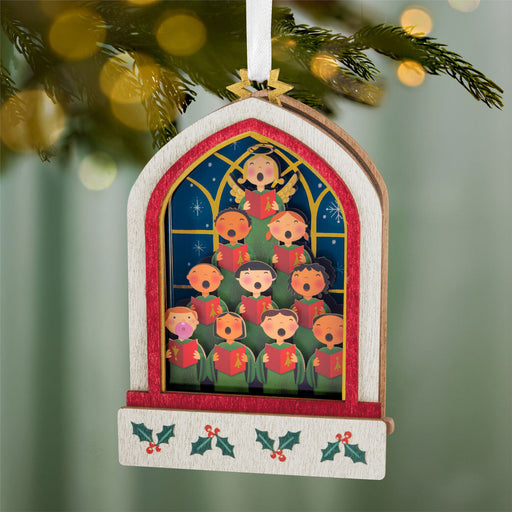 Decorative Christmas ornament with choir design on a tree
