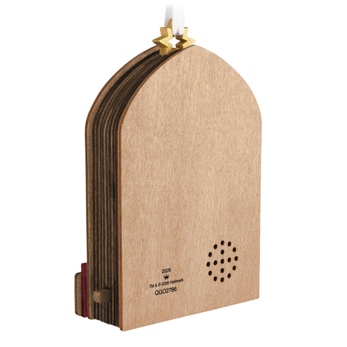 Back of ornament with a speaker with a star-shaped light on a white background
