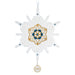 Decorative snowflake ornament with gold and blue design on a white background