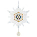 Decorative snowflake ornament with gold and blue design on a white background